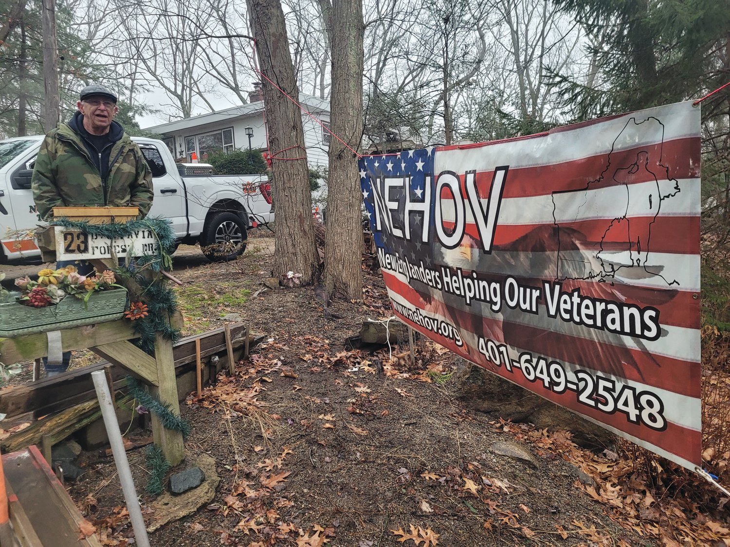 NEHOV HELPS: New Englanders Helping Our Veterans President & Founder Jim Collins and his organization helped Bernard “Bernie” Pavia get back on his feet. The group’s banner hangs outside Pavia’s Forest Drive home.